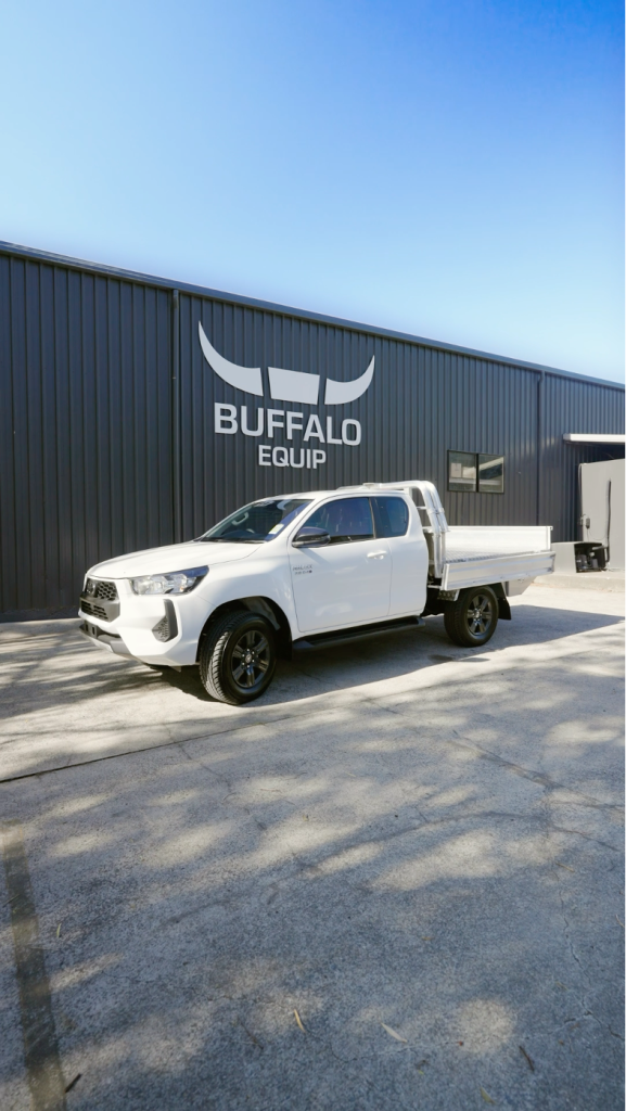 White Hilux with buffalo tray on the back