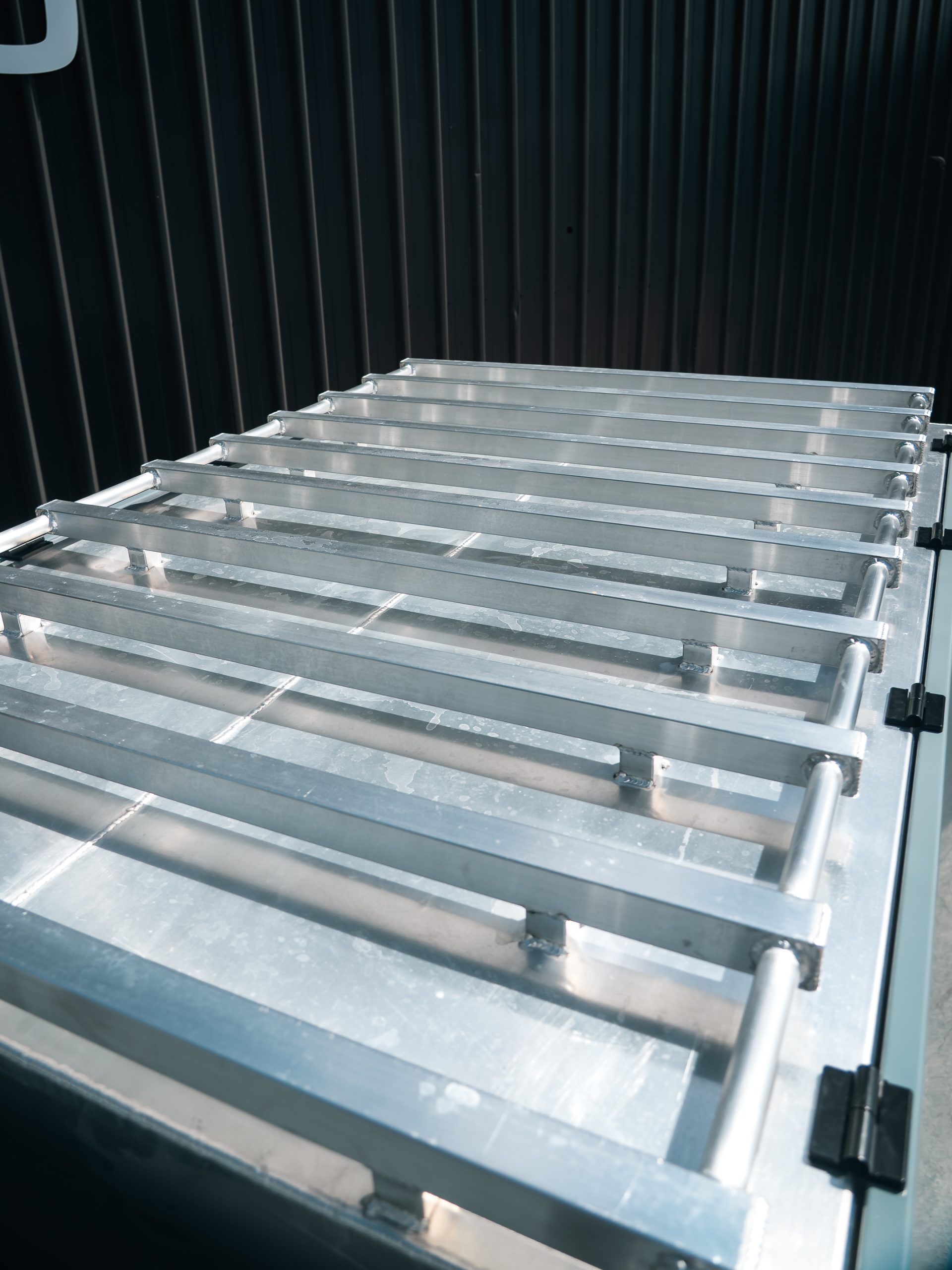 Inspiration Heavy-Duty Chassis Mount Canopy with Eleven Roof Rack Bars with Connecting Tie Down Rails Welded to the Roof and Extending 300mm Over the Cab